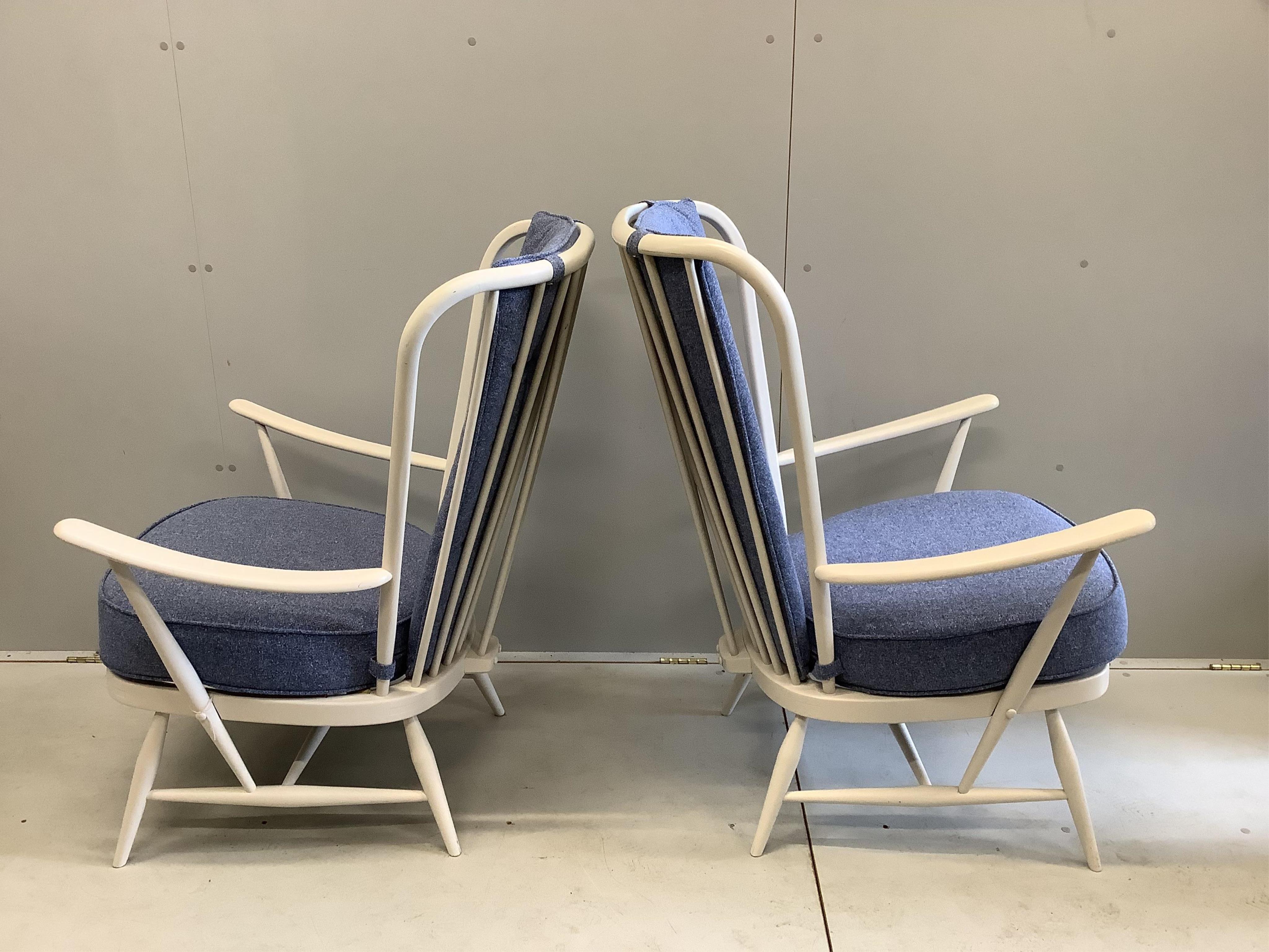 A pair of Ercol Evergreen armchairs, width 73cm, depth 60cm, height 104cm